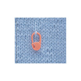 353 locking stitch marker hanging from a knit stitch